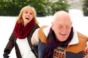senior couple in the snow | Rosen Optometry in St. Louis MO 